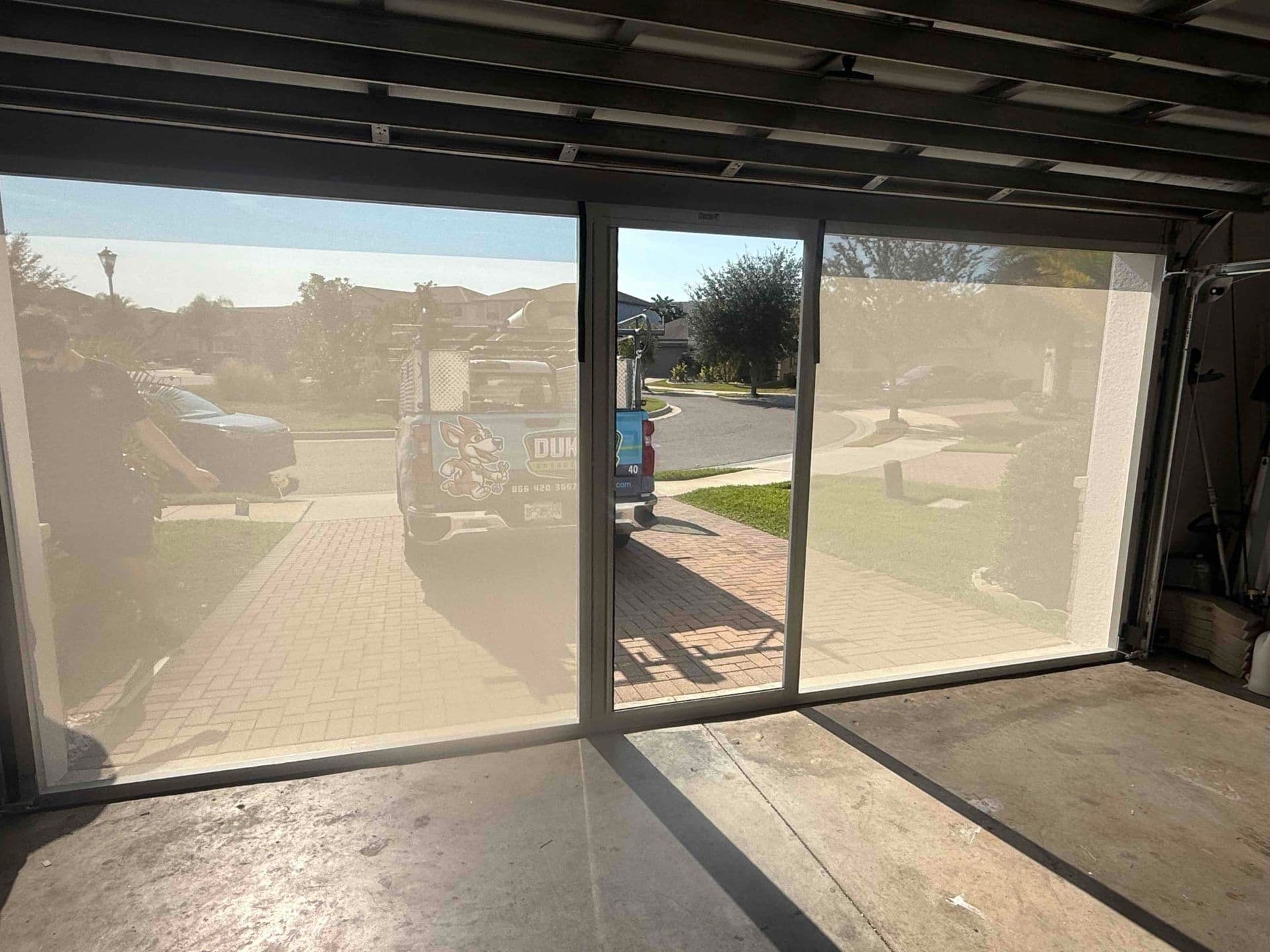 Retractable Garage Door Screen with Door from Inside View in Florida