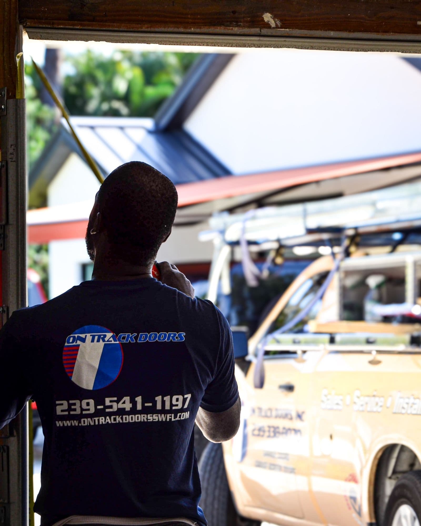 On Track Door Employee with Company Truck